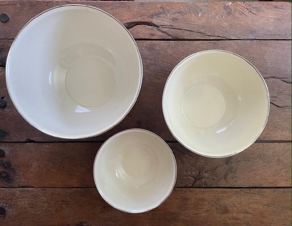 Set of bright red enamel bowls for kitchen decoration and use