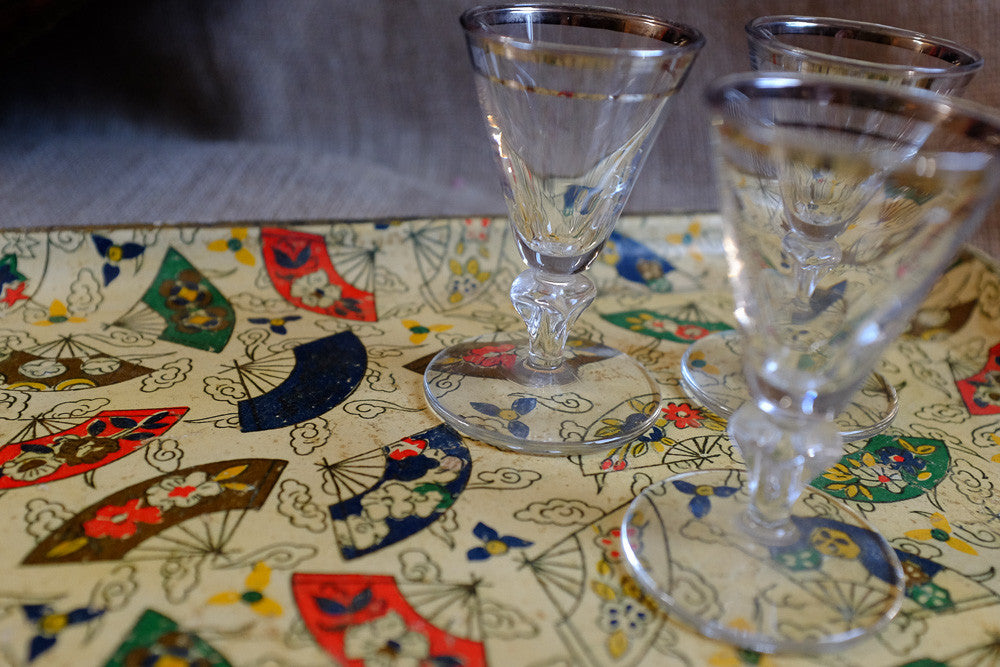 Vintage cocktail fan tray with mid century barware design.