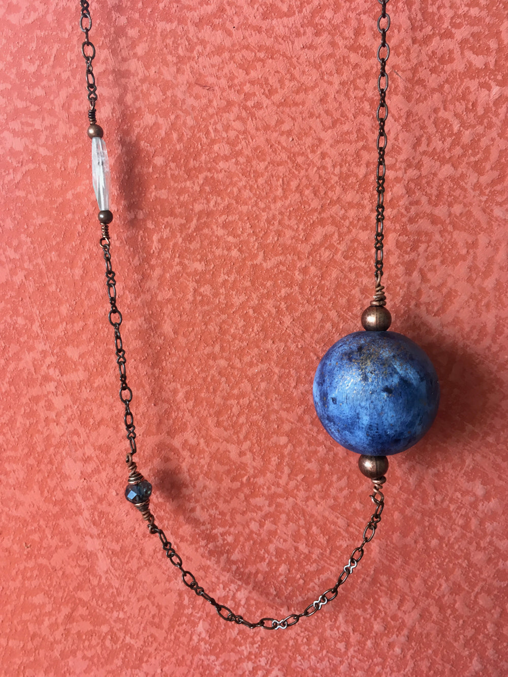 Handmade earth bead necklace on a copper chain with natural stones.