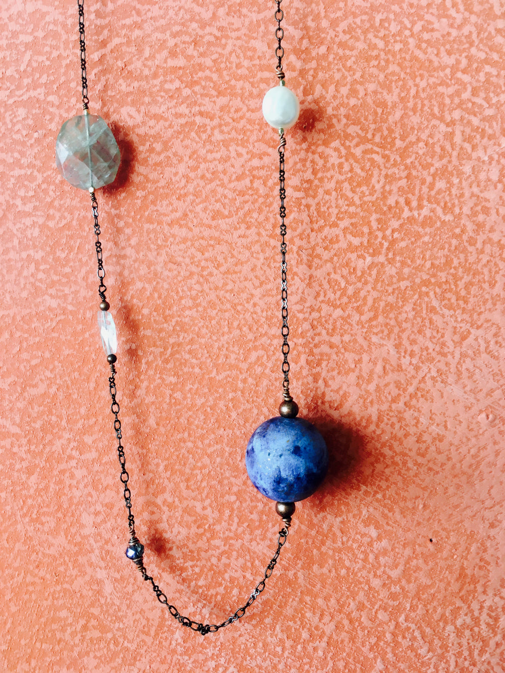 Handmade earth bead necklace on a copper chain with natural stones.