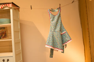 Handmade apron with ric-rac trim and vintage pattern.