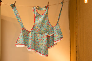 Handmade apron with ric-rac trim and vintage pattern.