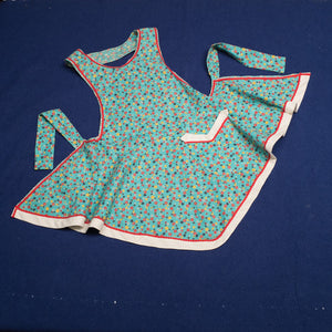 Handmade apron with ric-rac trim and vintage pattern.